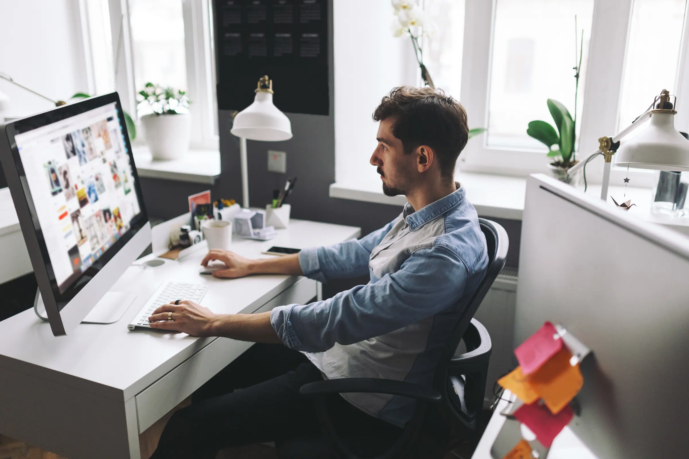 A business owner weighing options at a desk — the questions to ask before signing with a provider.