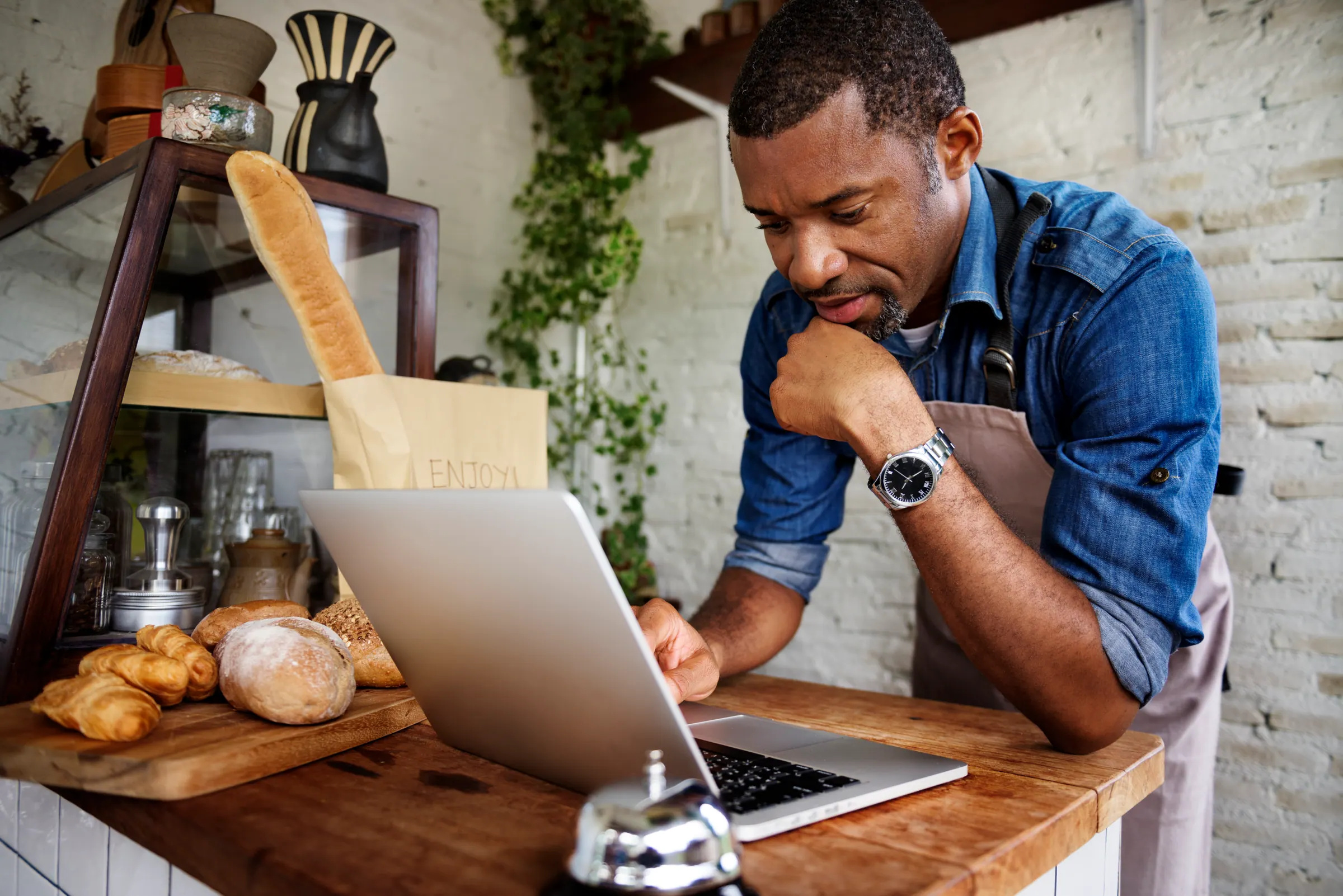 One operator at a laptop — the lean model that keeps the price where it is.