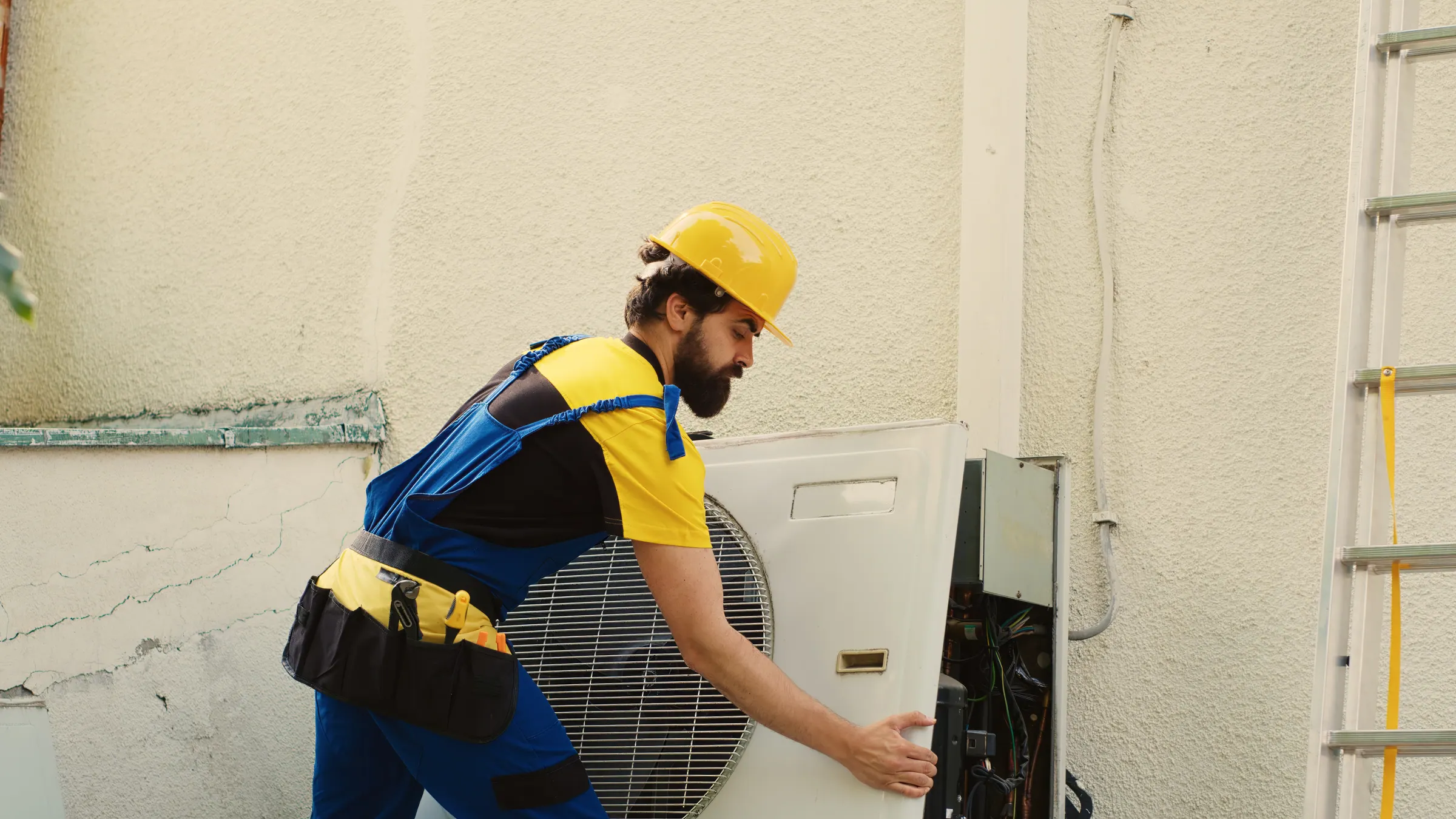An HVAC technician servicing a condenser unit — the trade behind the Cedar Rapids lead-cost math.